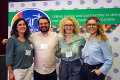 Arts Advocates posing at step and repeat