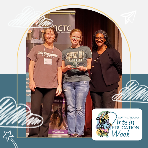 Picture of Jenny Goodfellow  standing with festival adjudicators, Josephine Hall and Donna Bradby.  Jenny is holding the award and smiling.  She is a white woman with red hair tied back and is wearing an olive green tee shirt with the name of her school on it and faded jeans with holes in the knees.